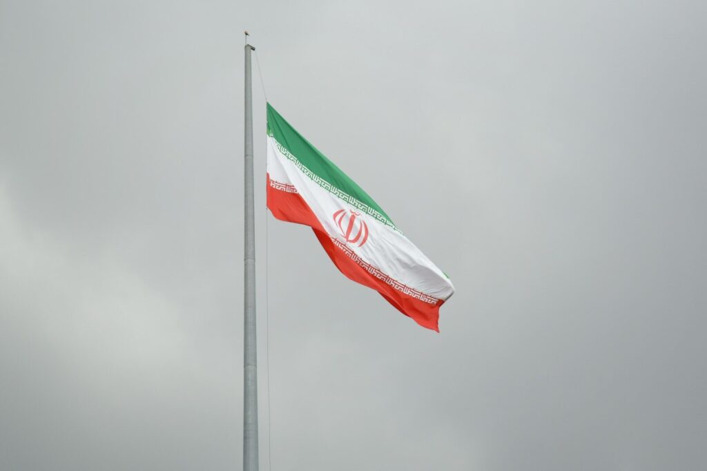 A flag flying in the wind on a cloudy day